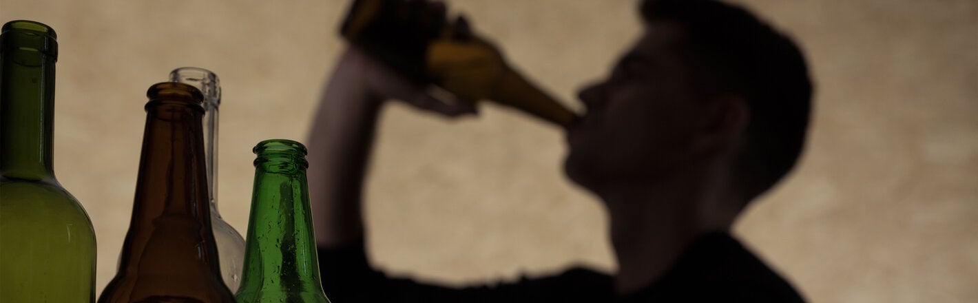 Person drinking alcohol at home