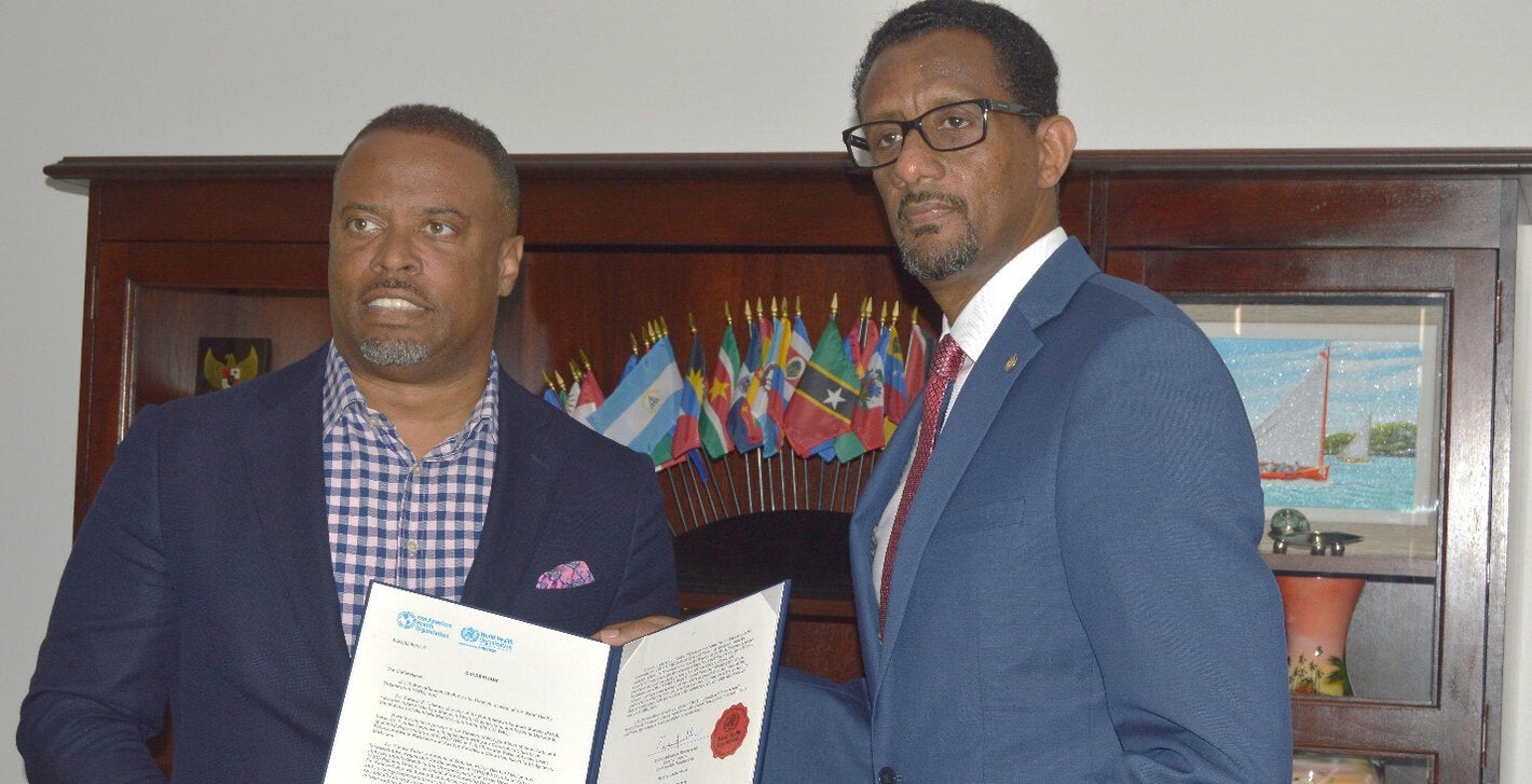 Dr Yitades Gebre (right) PAHO/WHO Representative to Barbados and the Eastern Caribbean Countries, presented his credentials to Minister Mark Brantley - Premier and Minister of Health - Nevis and Minister of Foreign Affairs, St Kitts and Nevis