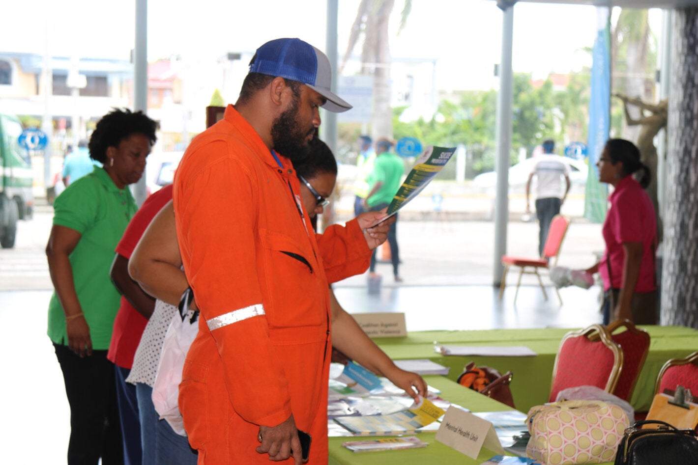 Onlooker reads a brochure 