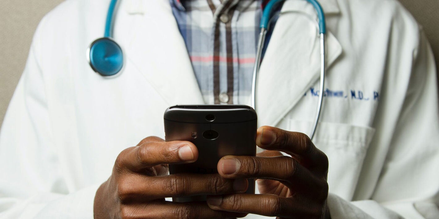 Doctor using cell phone