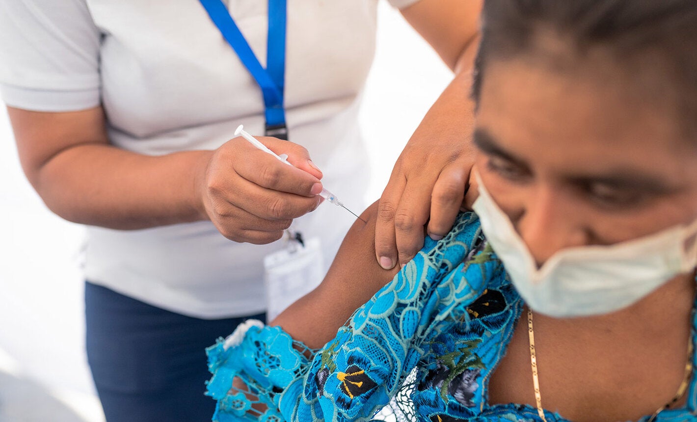 WOman is vaccinated against COVID-19 in Guatemala