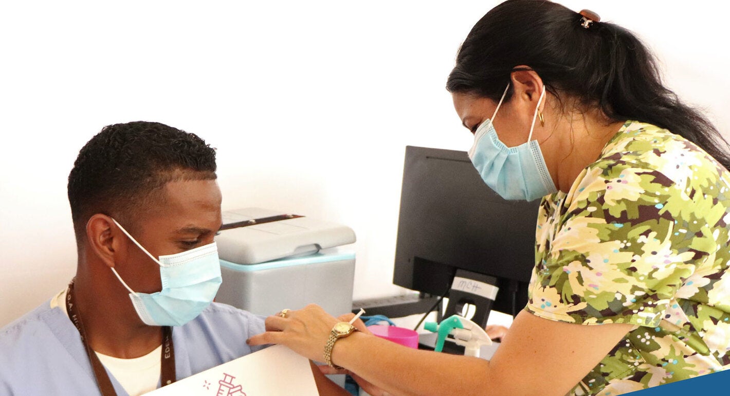 Man receives COVID-19 vaccination