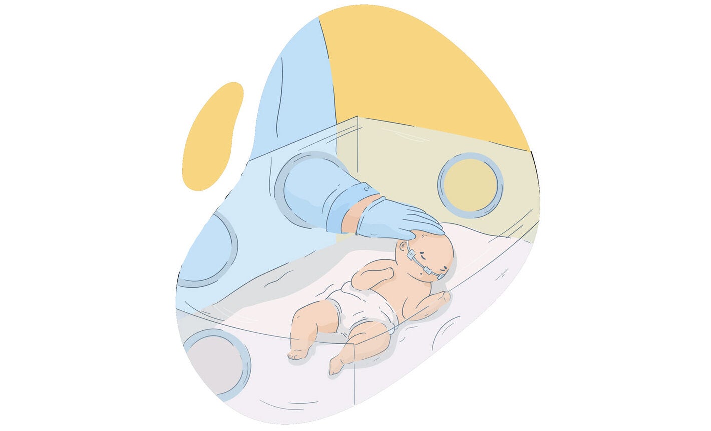 Newborn in incubator