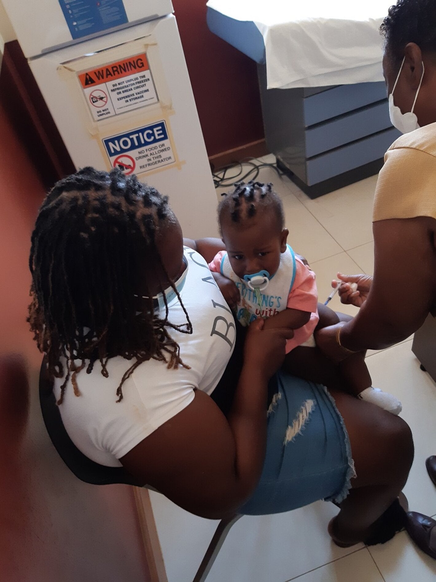 Baby gets immunized at the Kitson Town Health Centre
