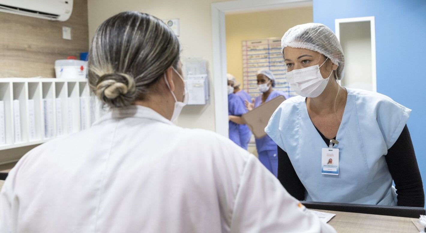 Two healh workers in a health care facility