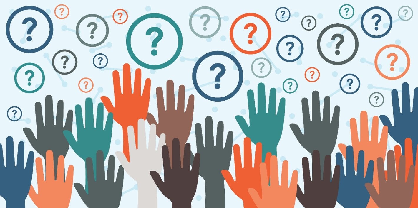 Raised hands of multiple colors