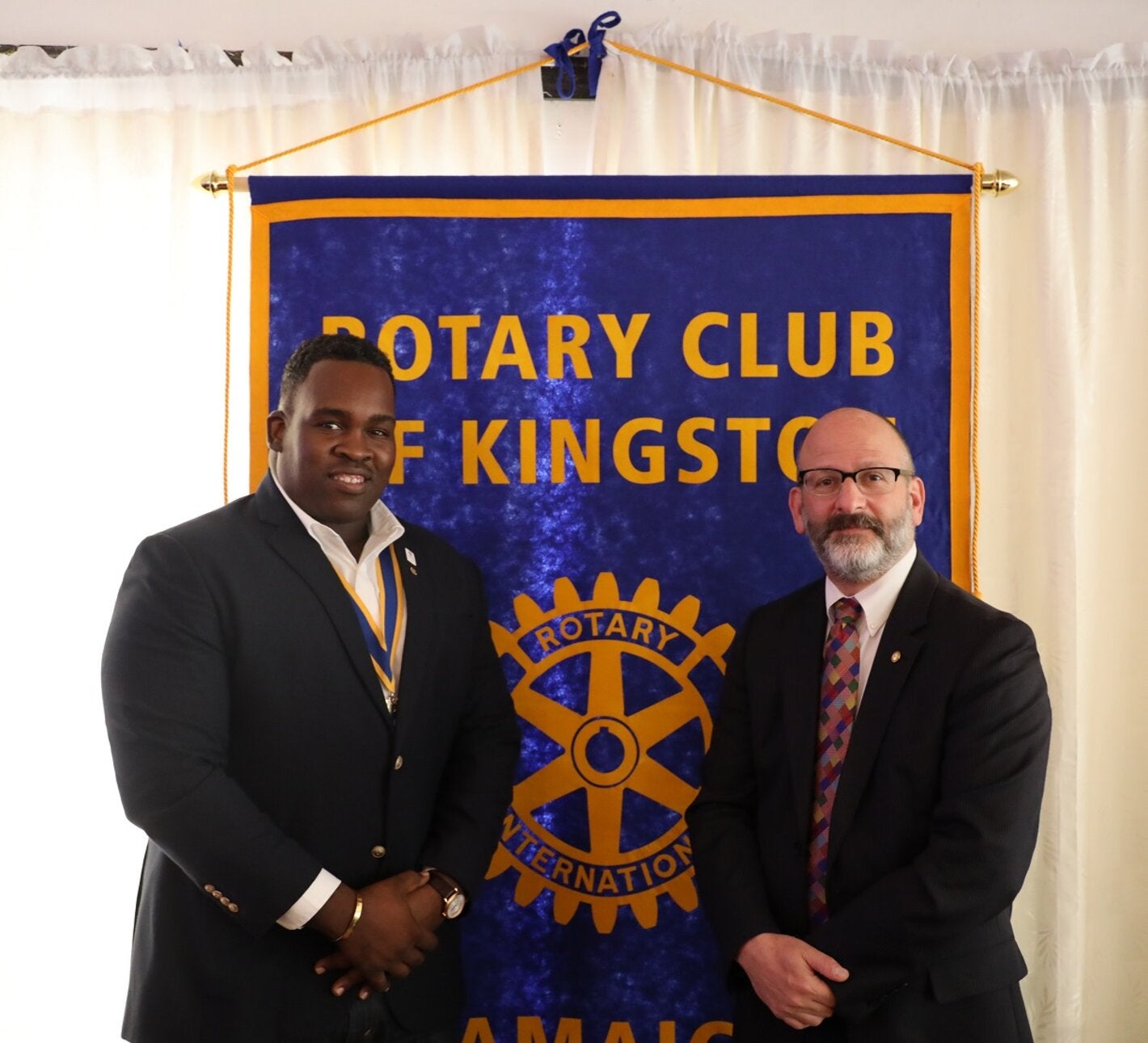 Mr. Ian Stein, Pan American Health Organization/ World Health Organization Representative to Jamaica, Bermuda and the Cayman Islands (right) paused to greet Karsten Johnson, President of the Rotary Club of Kingston after his lunchtime presentation on polio and NCDs