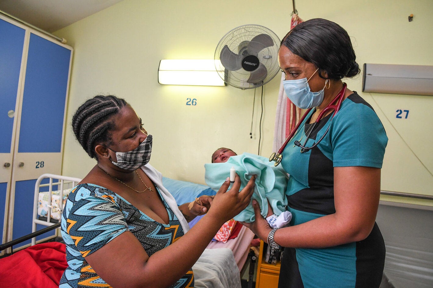 Mother with child receiving medical care