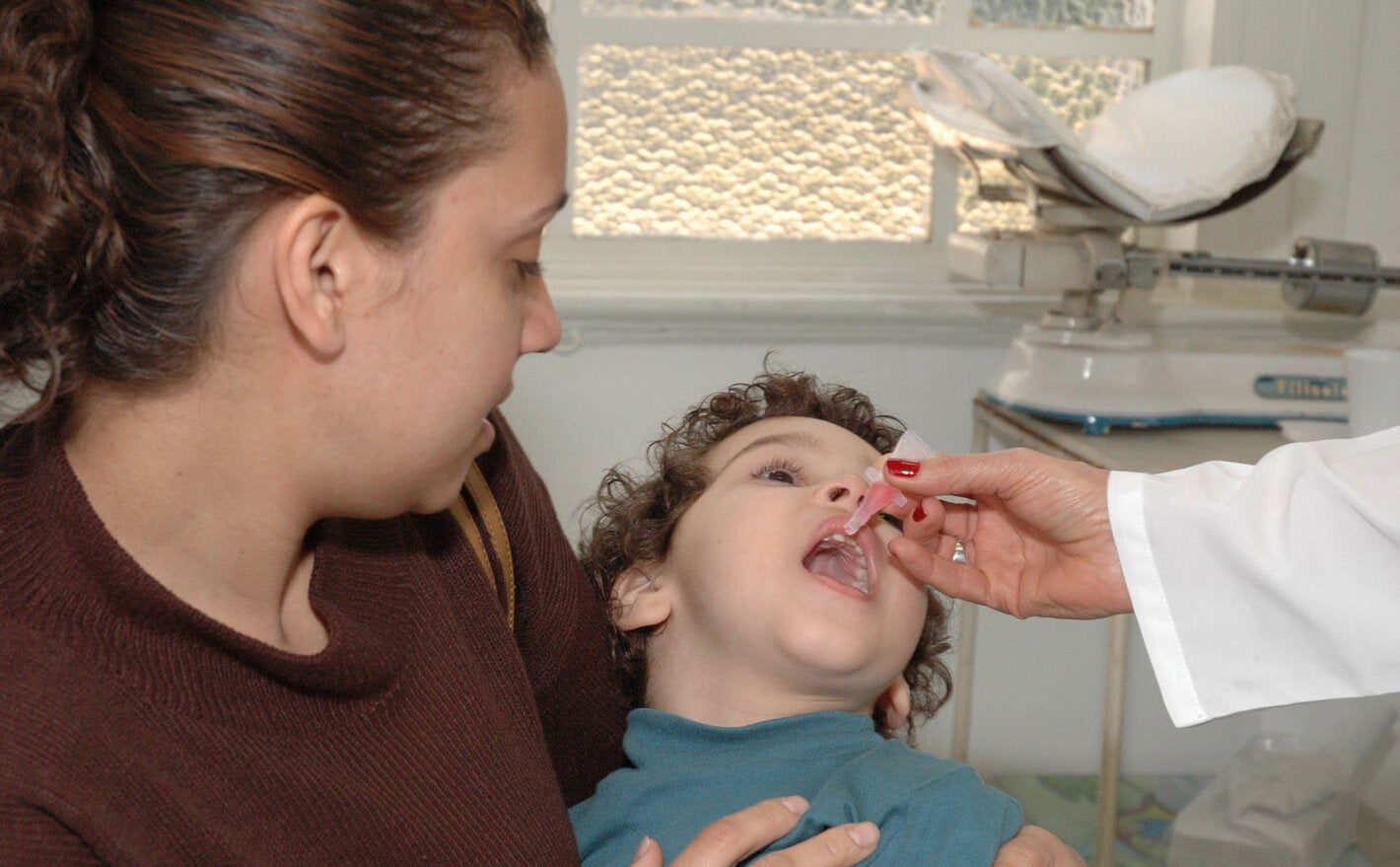 Boy receives polio vaccination