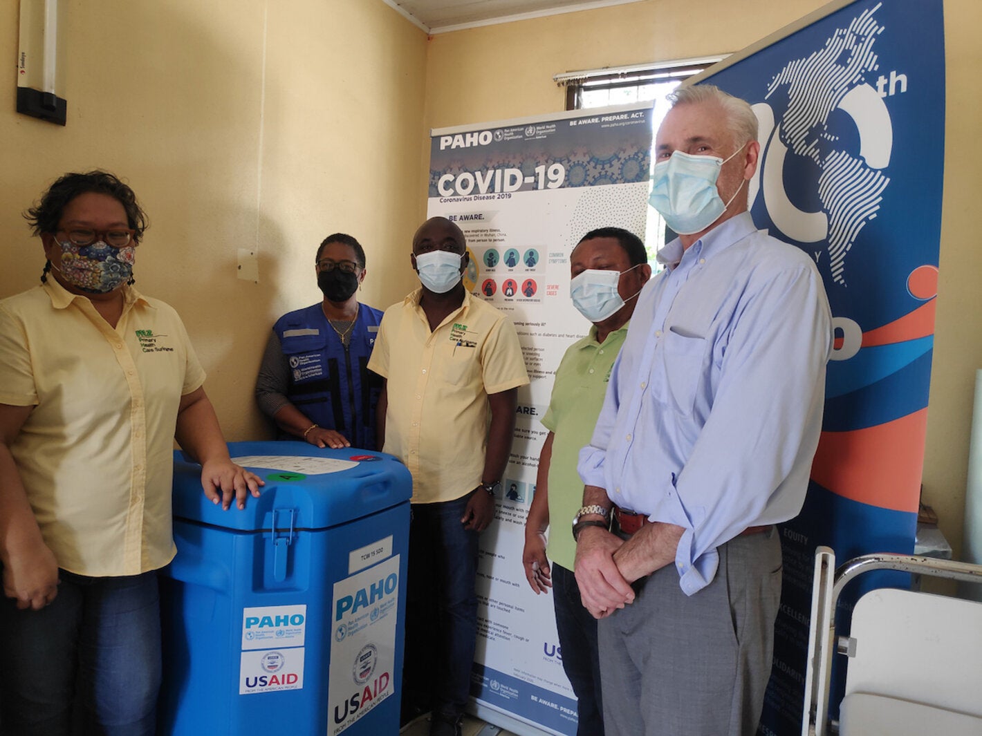 Medical Mission Director Dr. Maureen van Dijk,PAHO/WHO Representative Dr. Karen Lewis-Bell, Medical Mission Dr. Thompson Danso, Medical Mission Health Care Assistant Karel Wajacabo, and Mr. Philip Schwehm, Senior Development Advisor and Regional Economist for USAID in Eastern & Southern Caribbean during the handover.