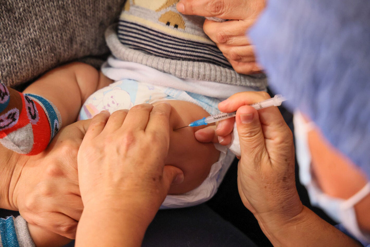 Young child receives vaccines