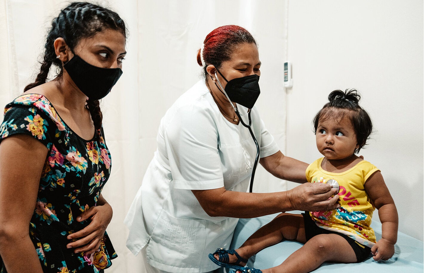 Nurse, mother and girl