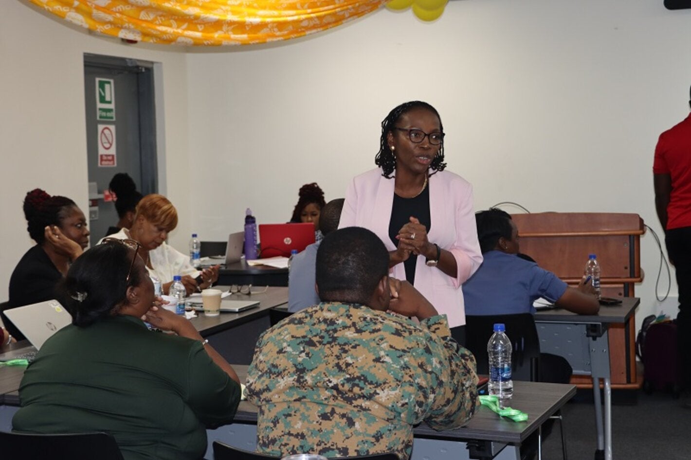 Dr. Claudina Cayetano PAHO's Mental Health Regional Advisor speaking with participants.