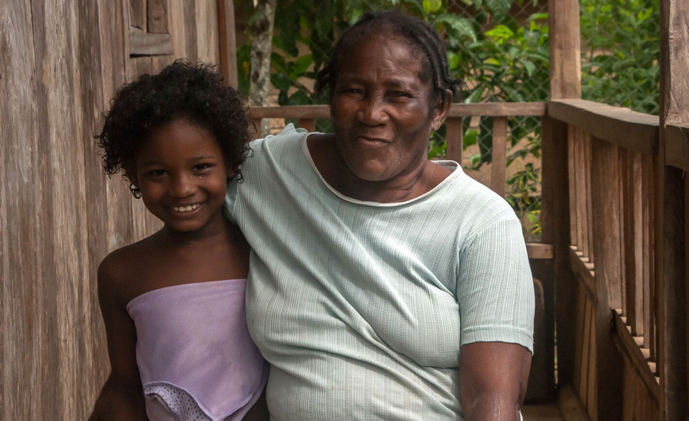 Woman embracing girl