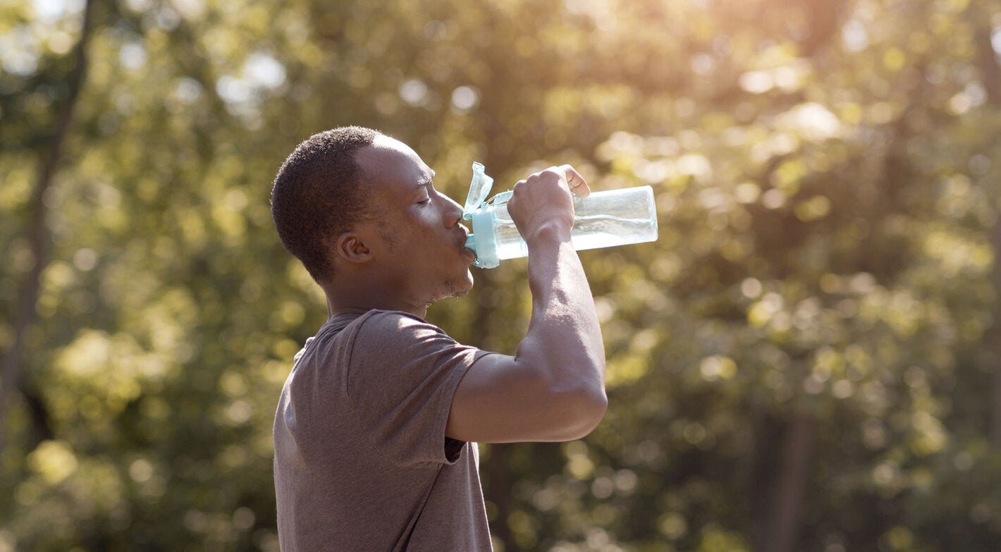 Young man drinking water