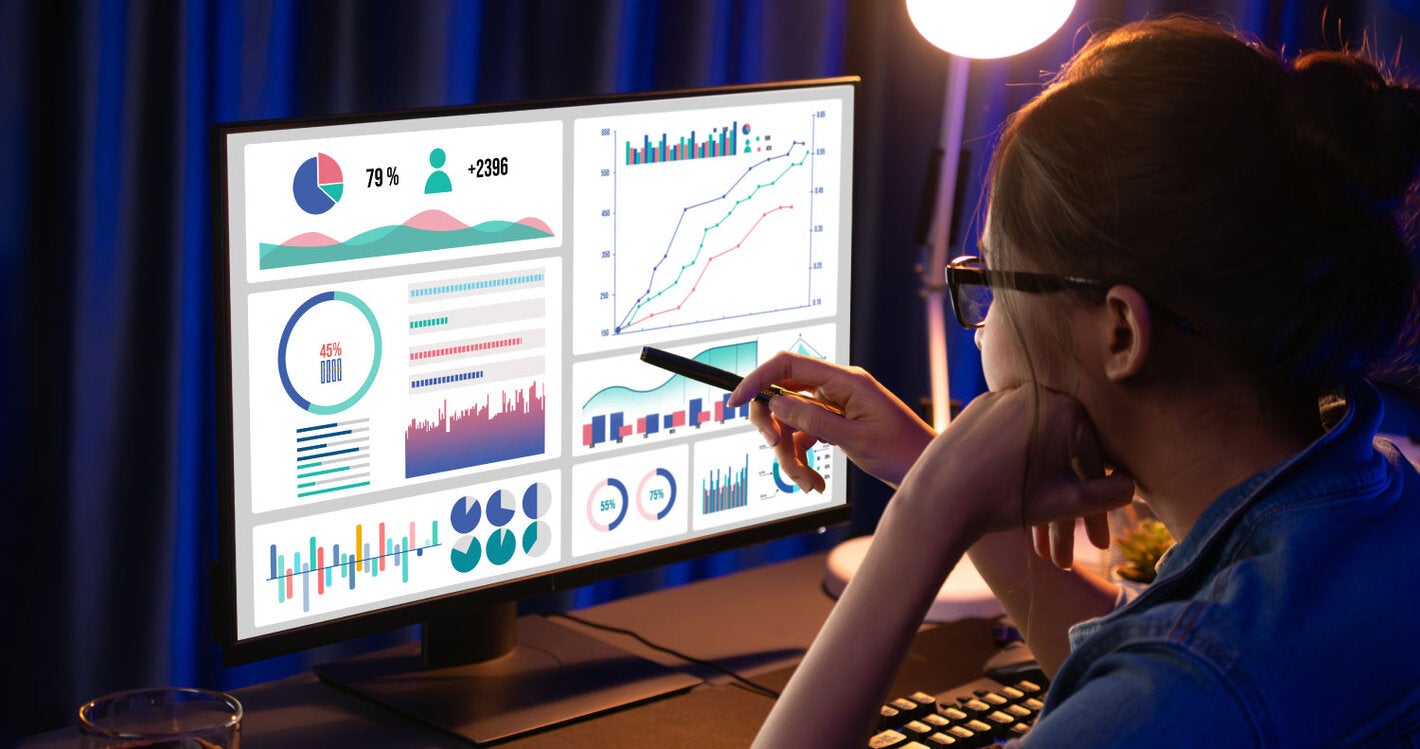 Woman performing data analysis on a computer