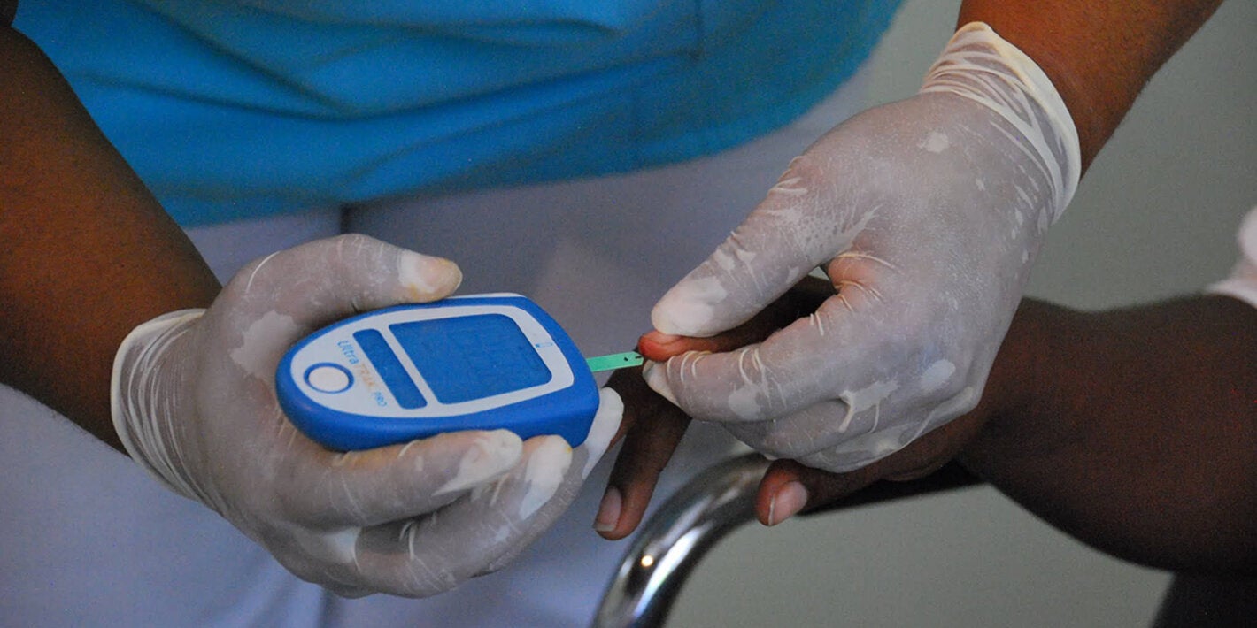 close focuse on health worker testing blood sugar