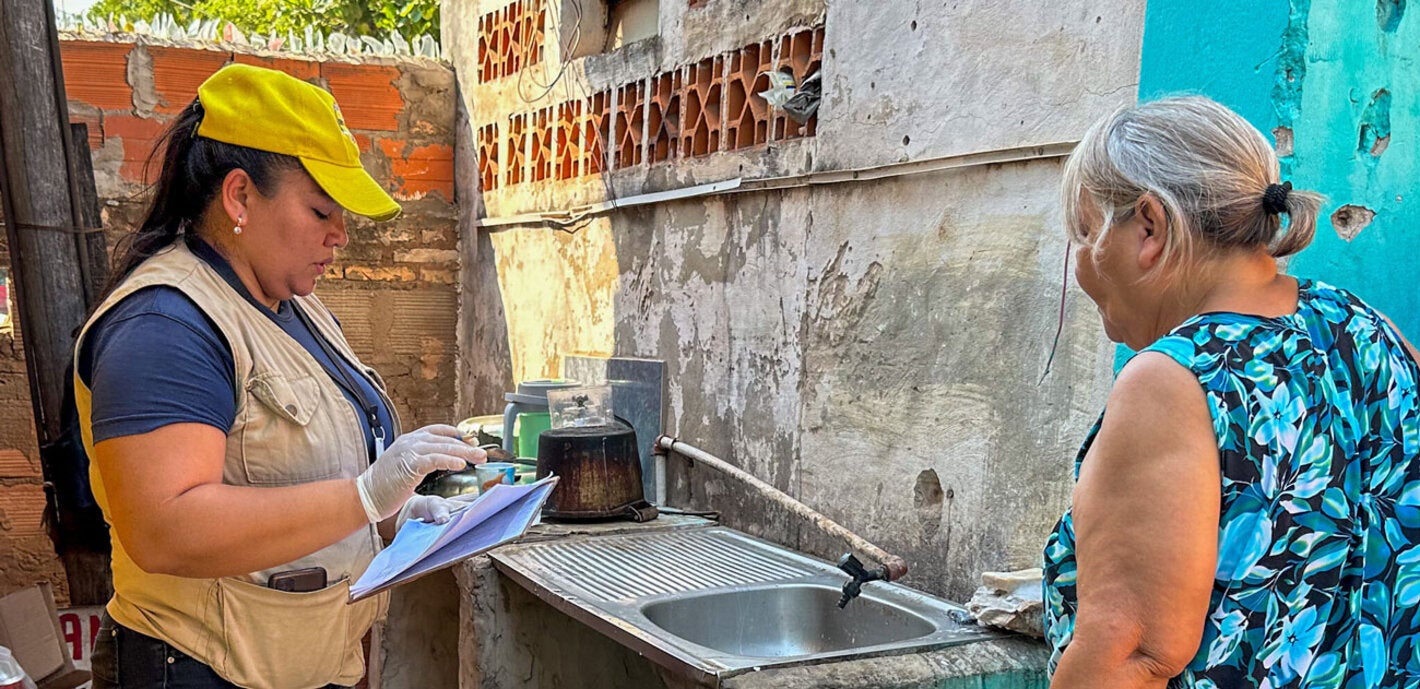 Health worker support  community by eliminating mosquito breeding grounds