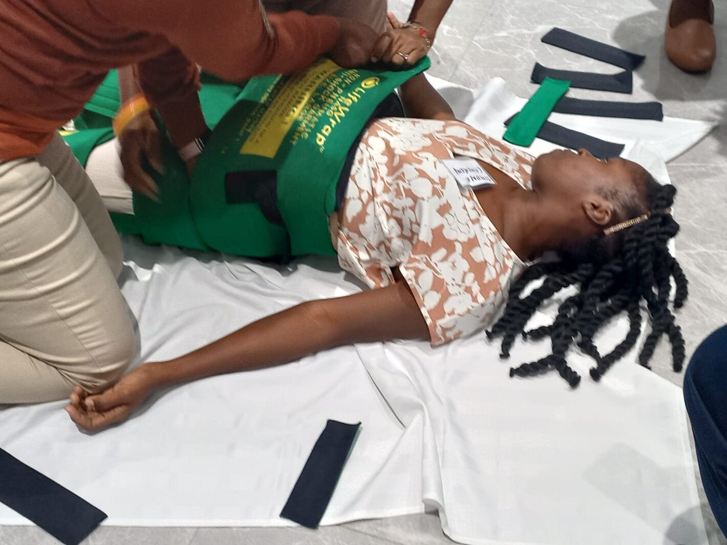 Health Care Workers practicing the use of Non-pneumatic Anti-shock Garment (NASG) for control of Post Partum Haemorrhage