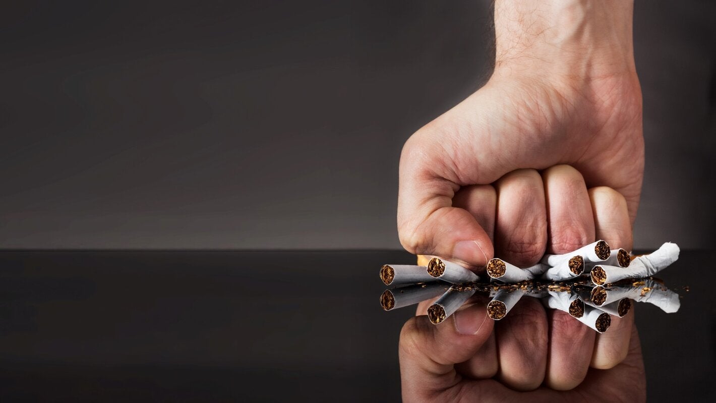 fist crushing cigarrettes