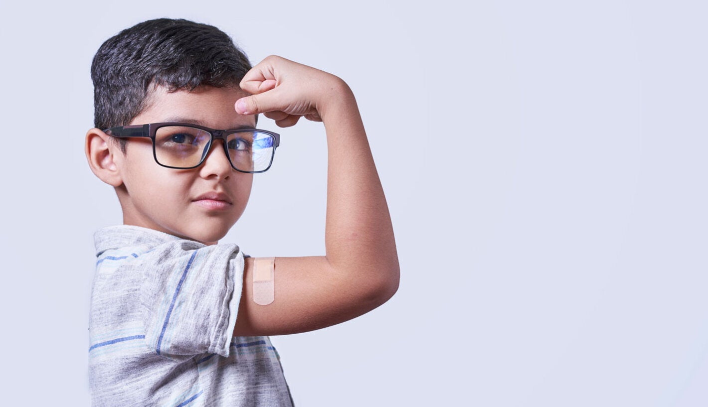 Vaccinated boy shows his arm