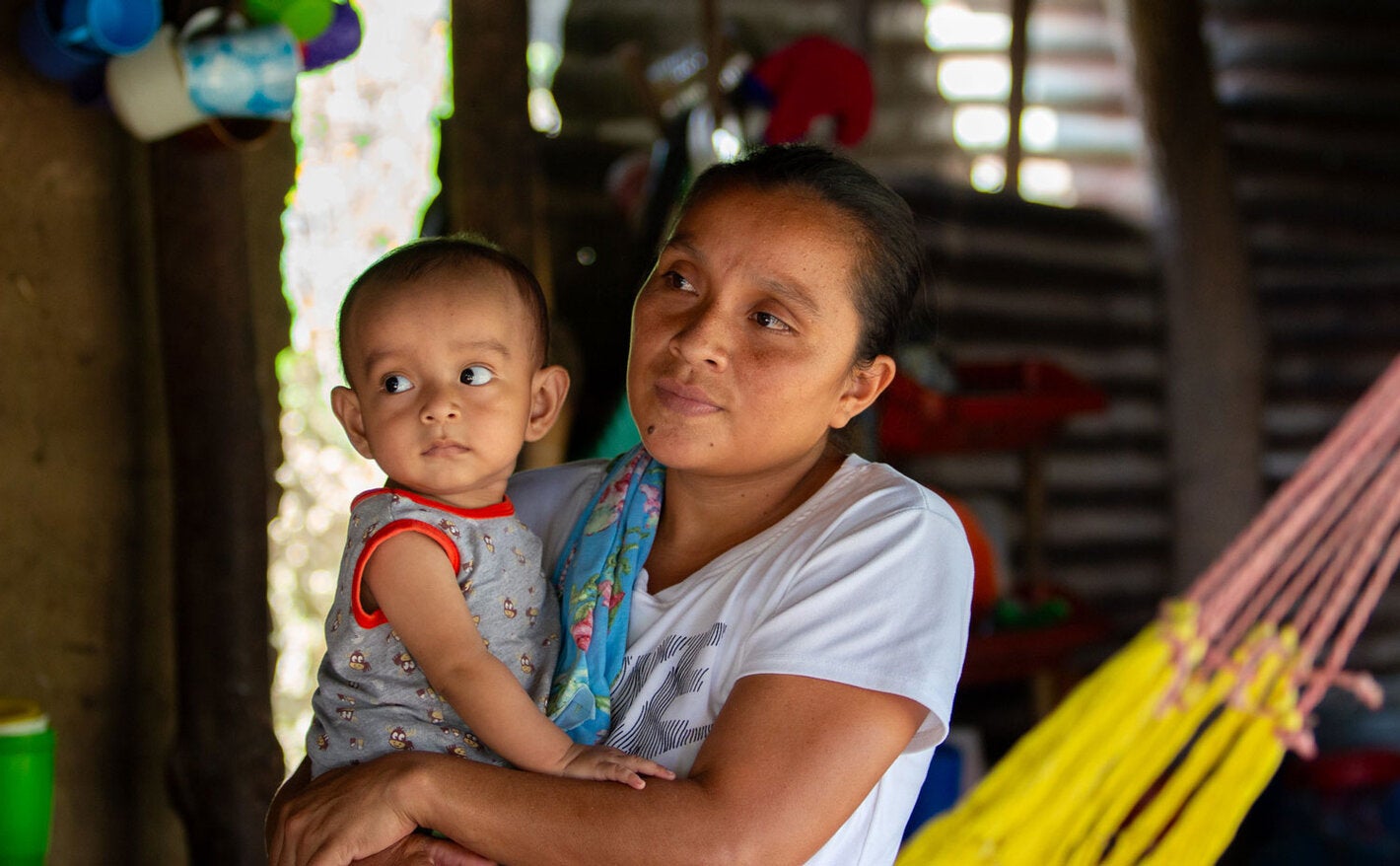 Mother holding child in arms