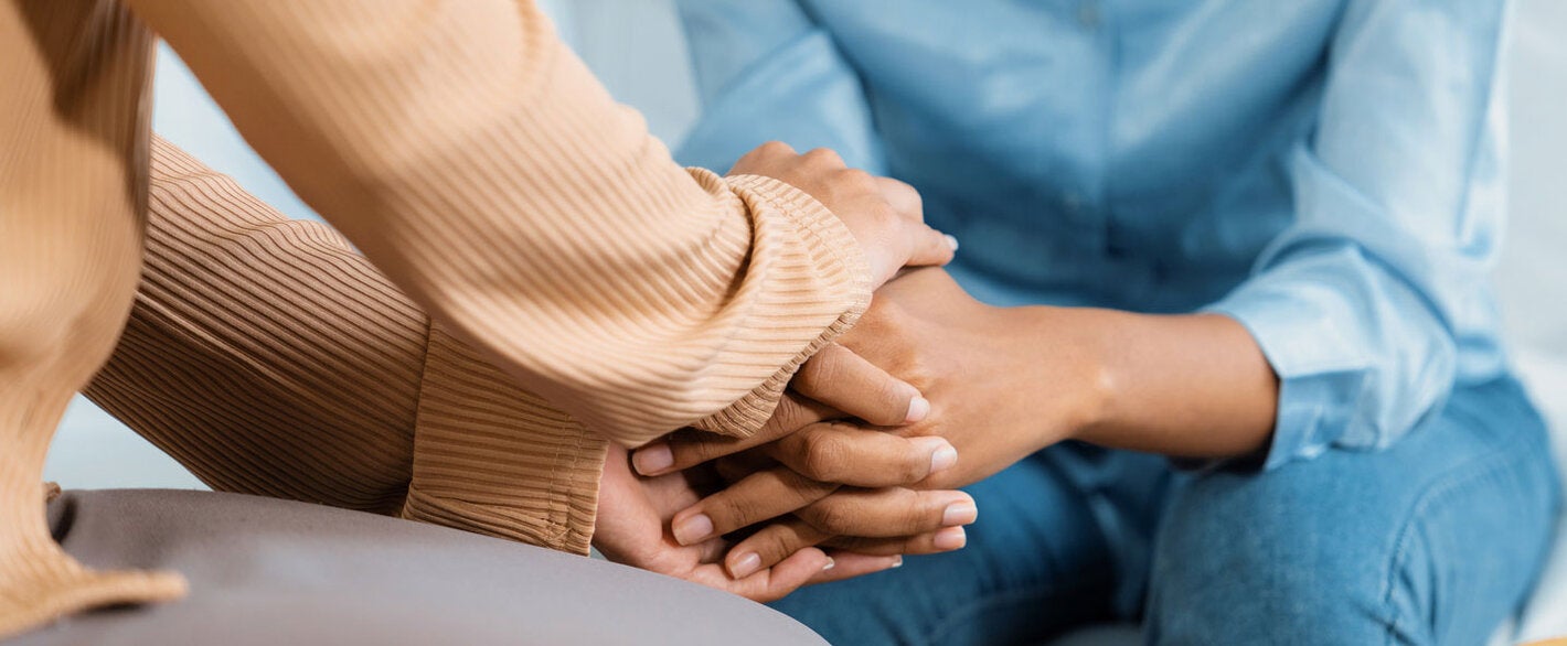 Holding hands as a gesture of support