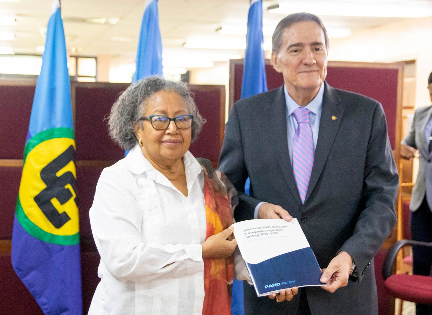 Dr. Carla N. Barbett, Secretary-General of CARICOM and Dr. Jarbas Barbosa pose after signing the agreement.