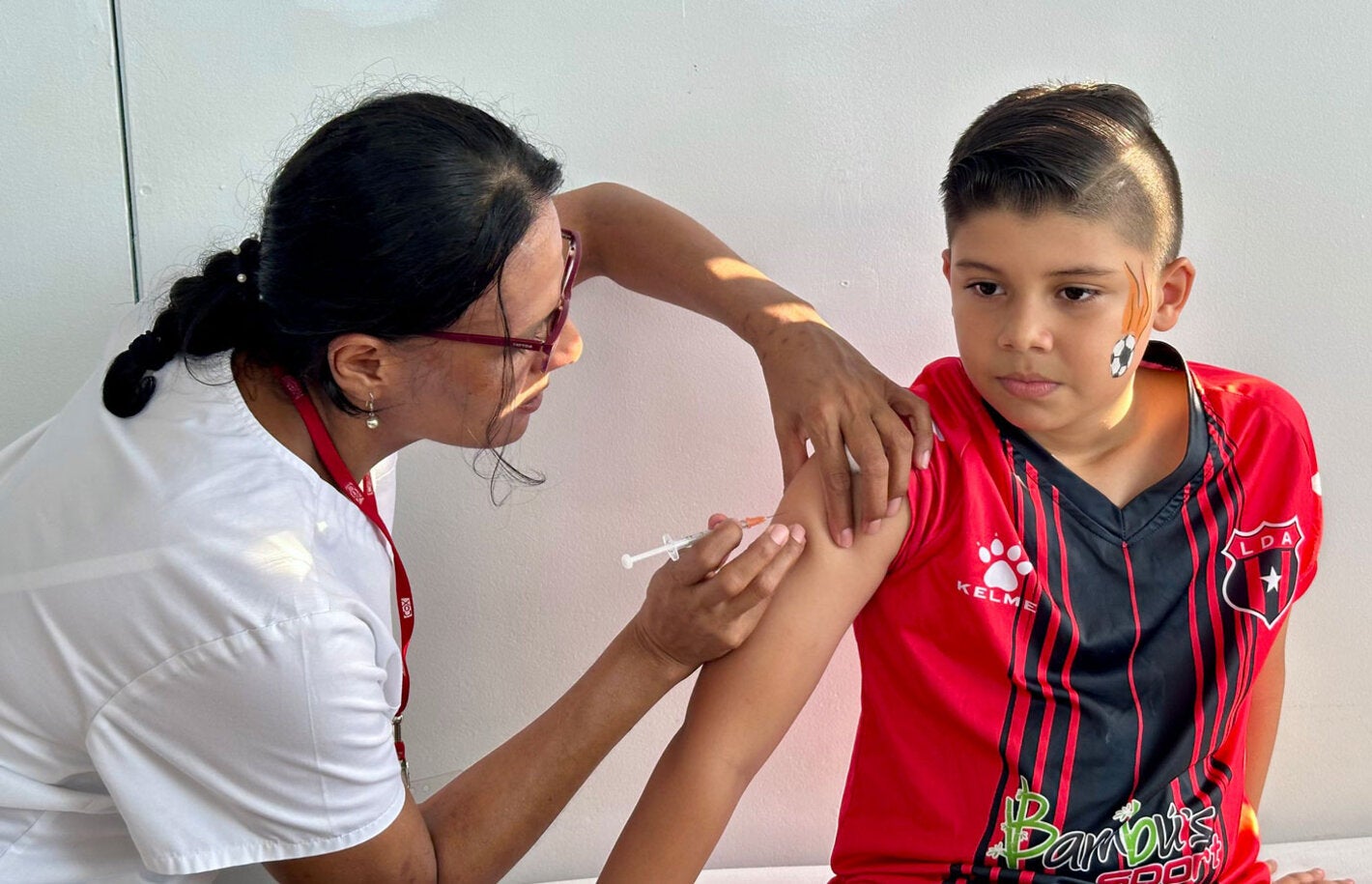 Boy receives vaccination 