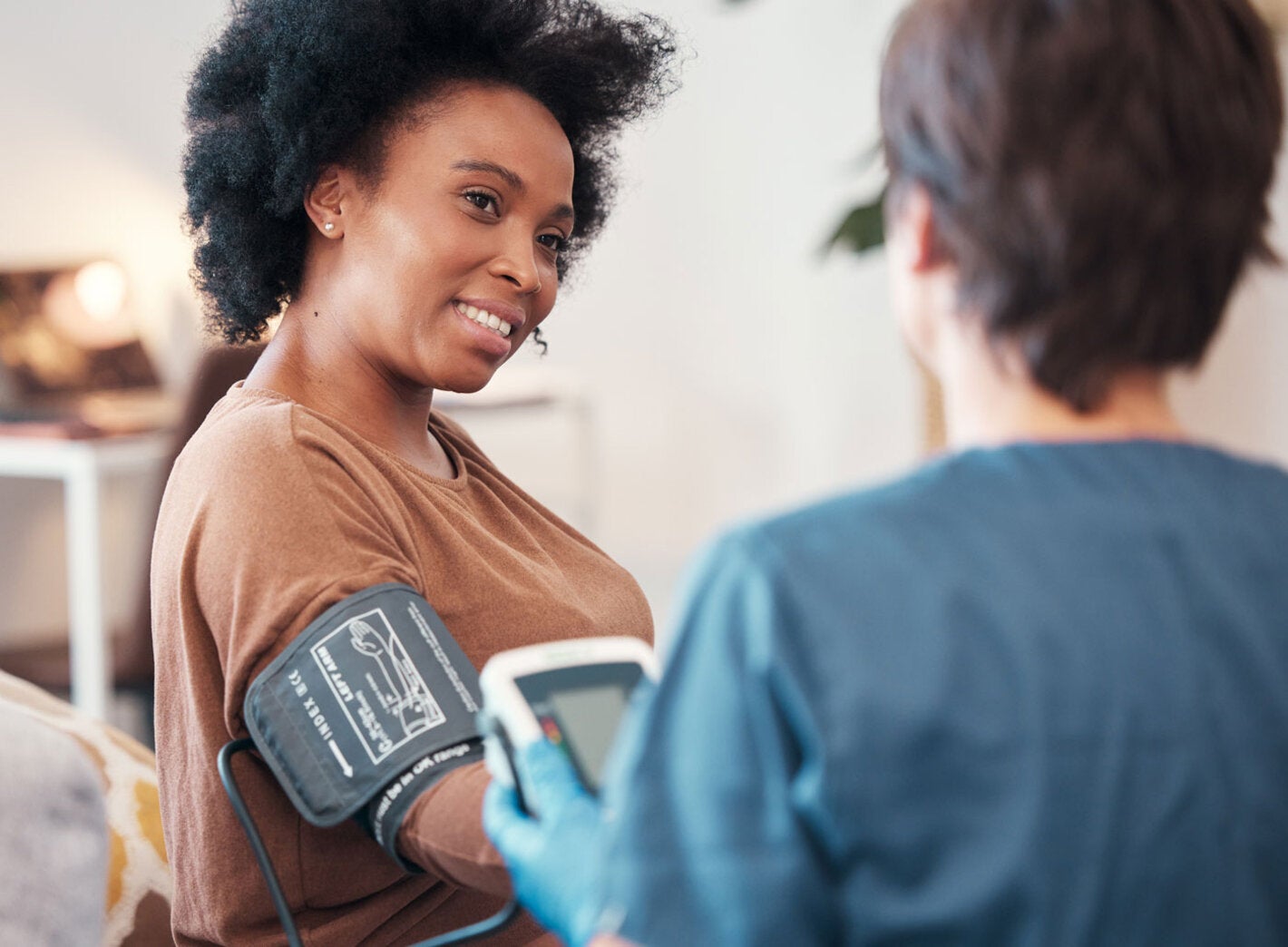 Woman having her blood pressure checked