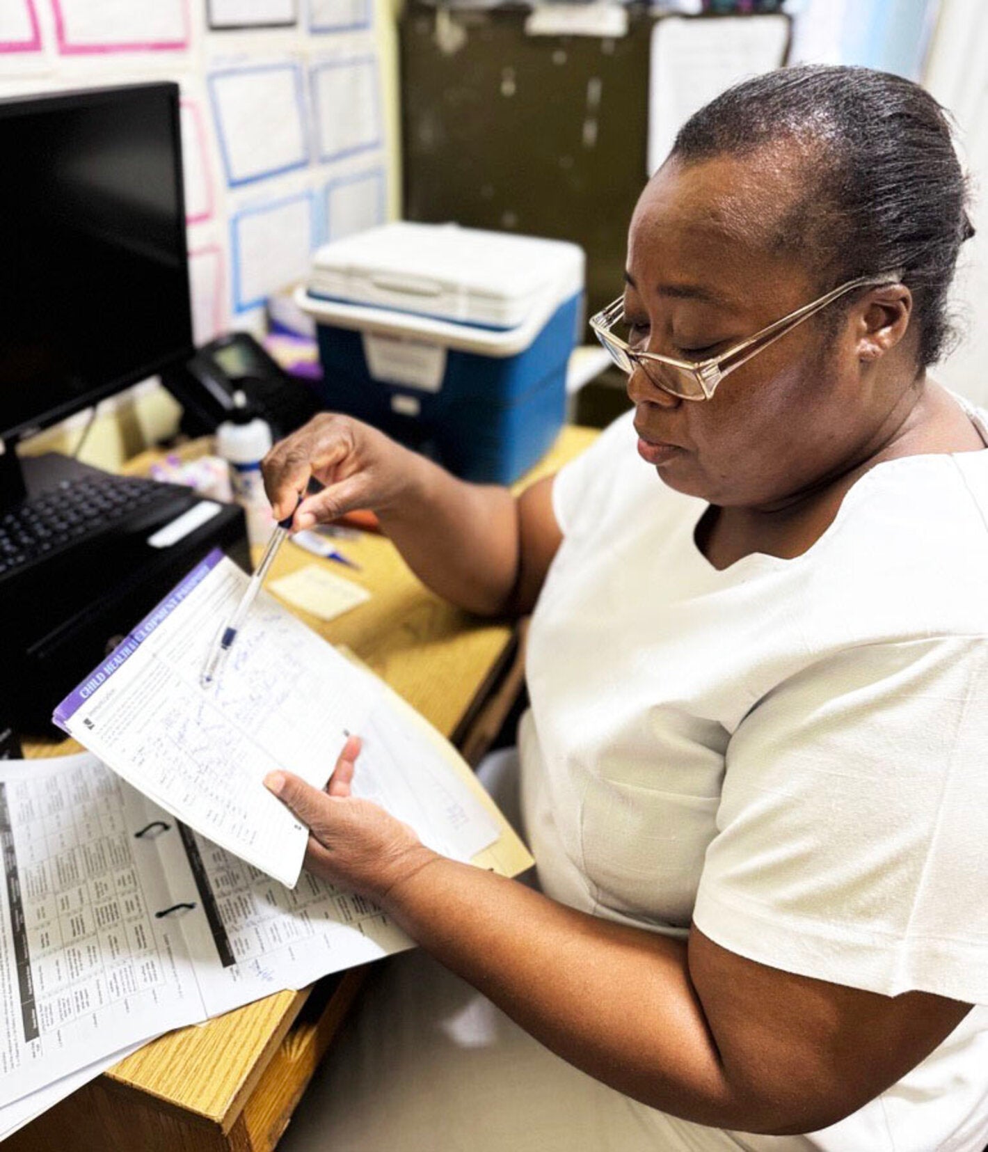 nurse reviews vaccine data