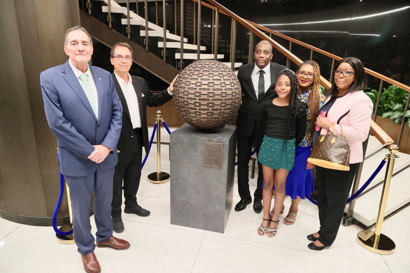 Dr. Barbosa, artist and family members of Dr. Etienne