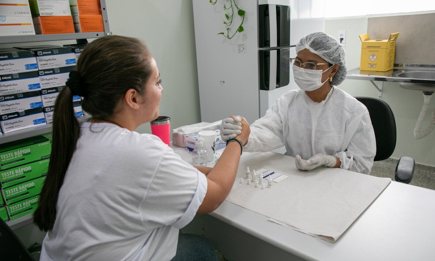 nurse and patient handshake