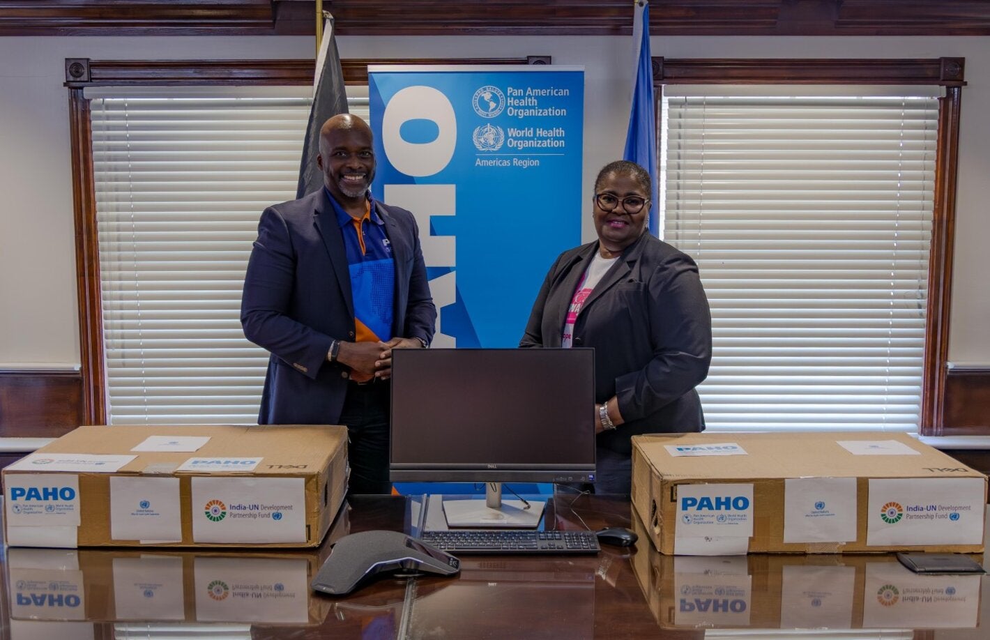 Dr. Anton Best, HSS Advisor (PAHO/WHO) presents the donations to Dr. Keva Thompson, Deputy Managing Director of the Public Hospital Authority. 