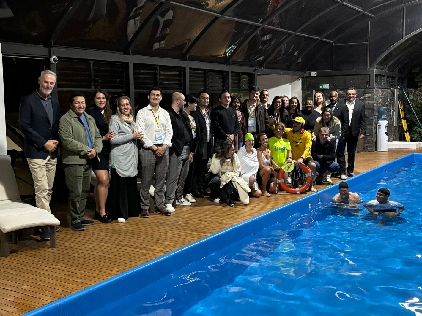 people standing by the pool