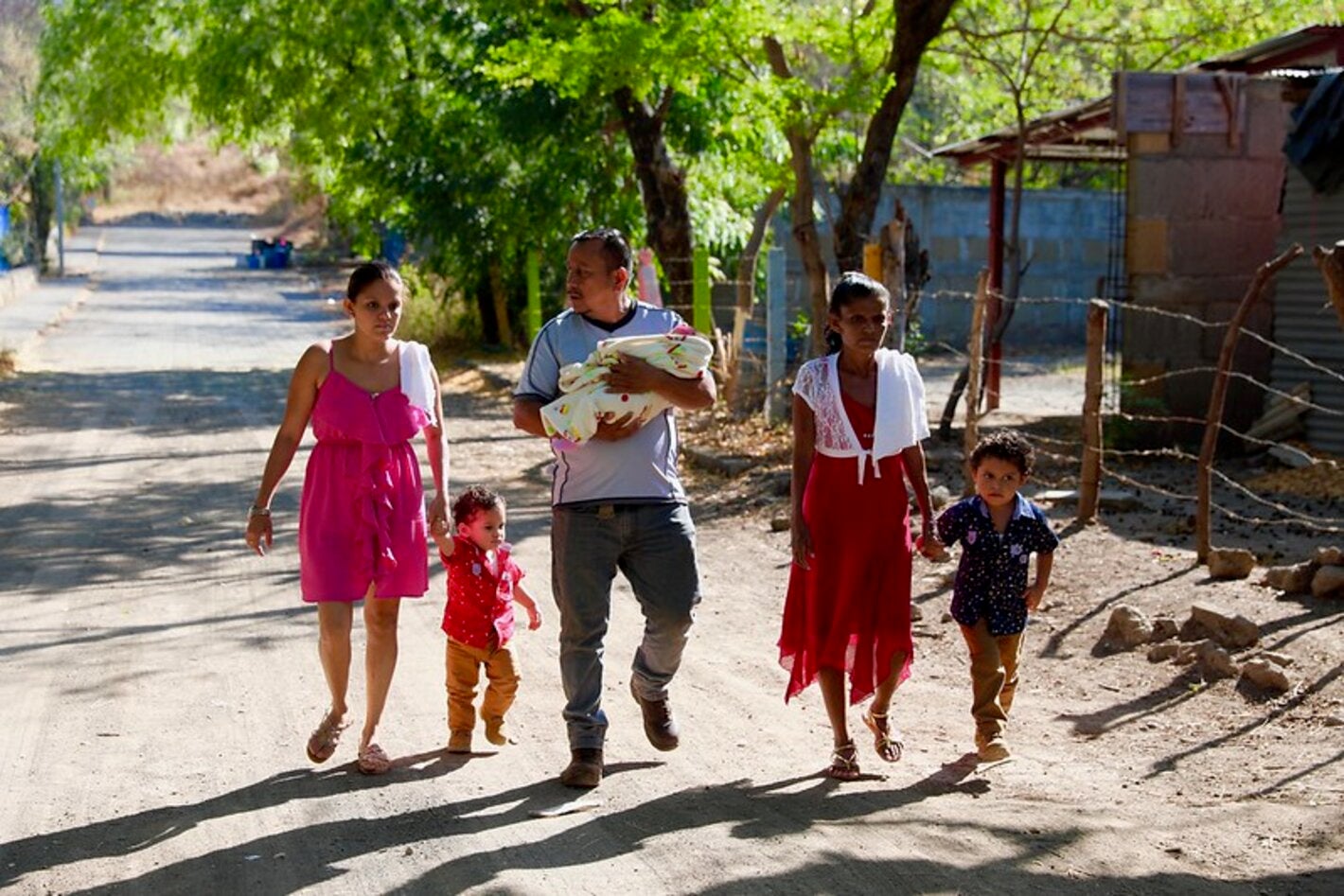 family walking down a rural street