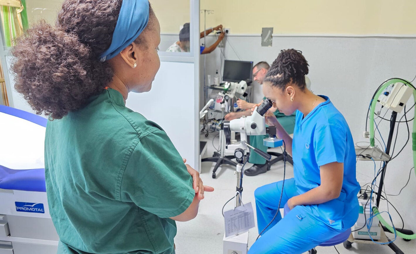 Doctors testing medical equipment