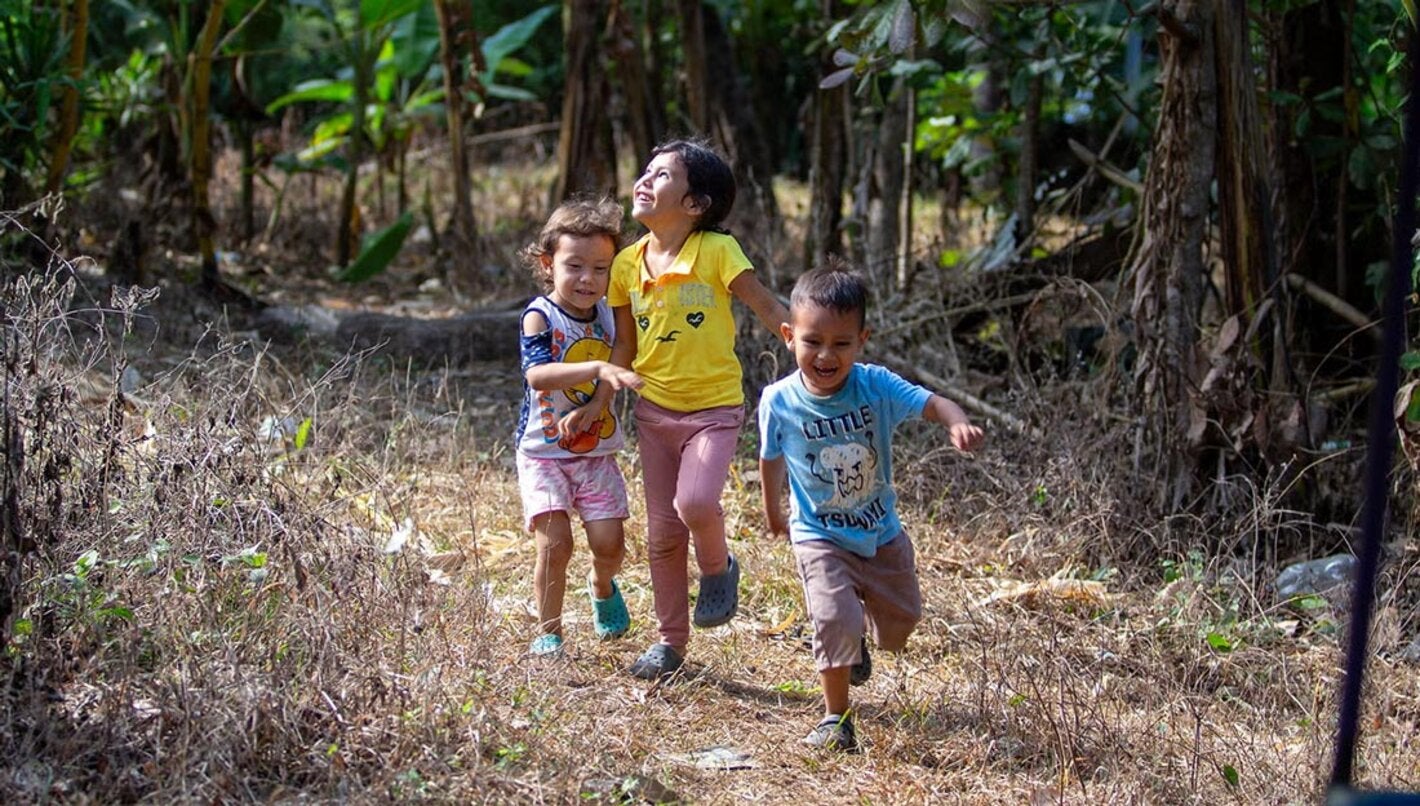 Children running through the fields