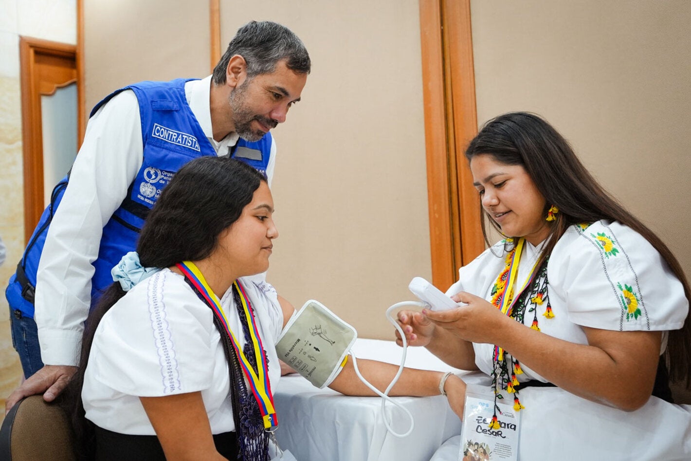 Woman has her blood pressure checked