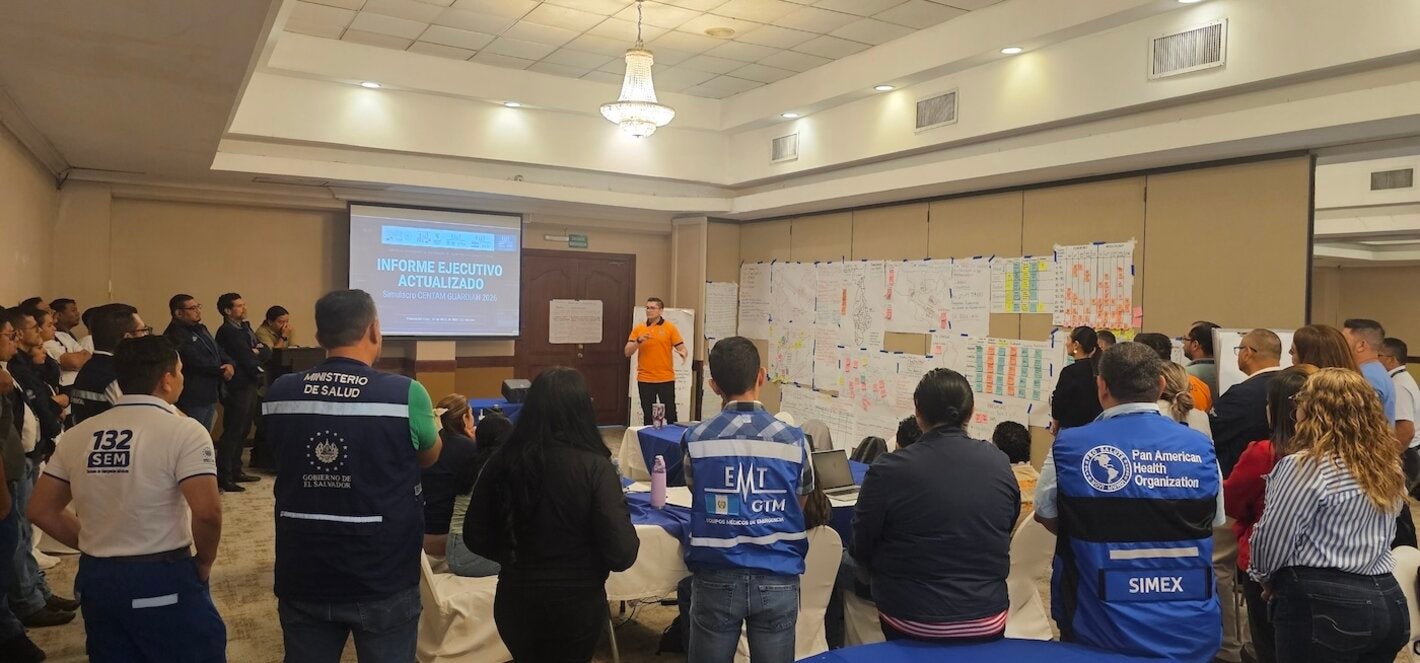 Emergency personnel in an operational briefing during a regional simulation exercise.