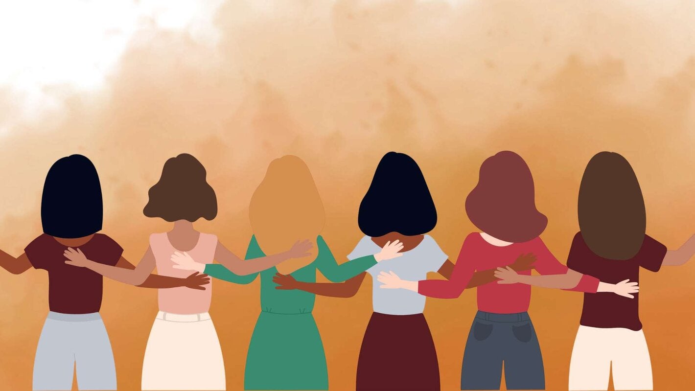 women together holding hands
