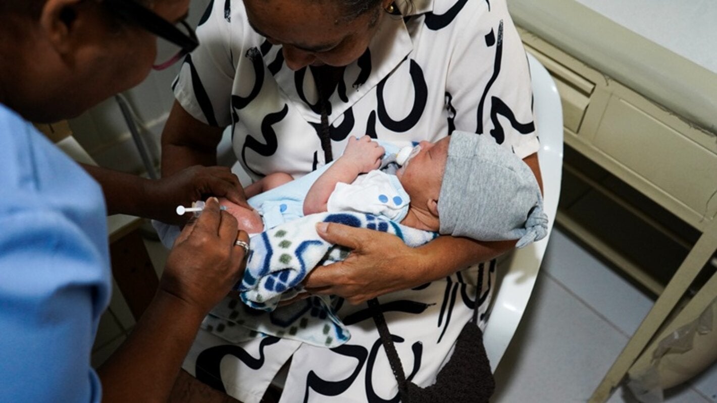 women holding baby