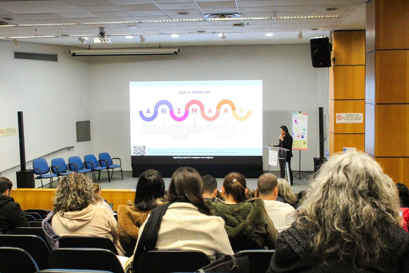 people listening in an auditorium