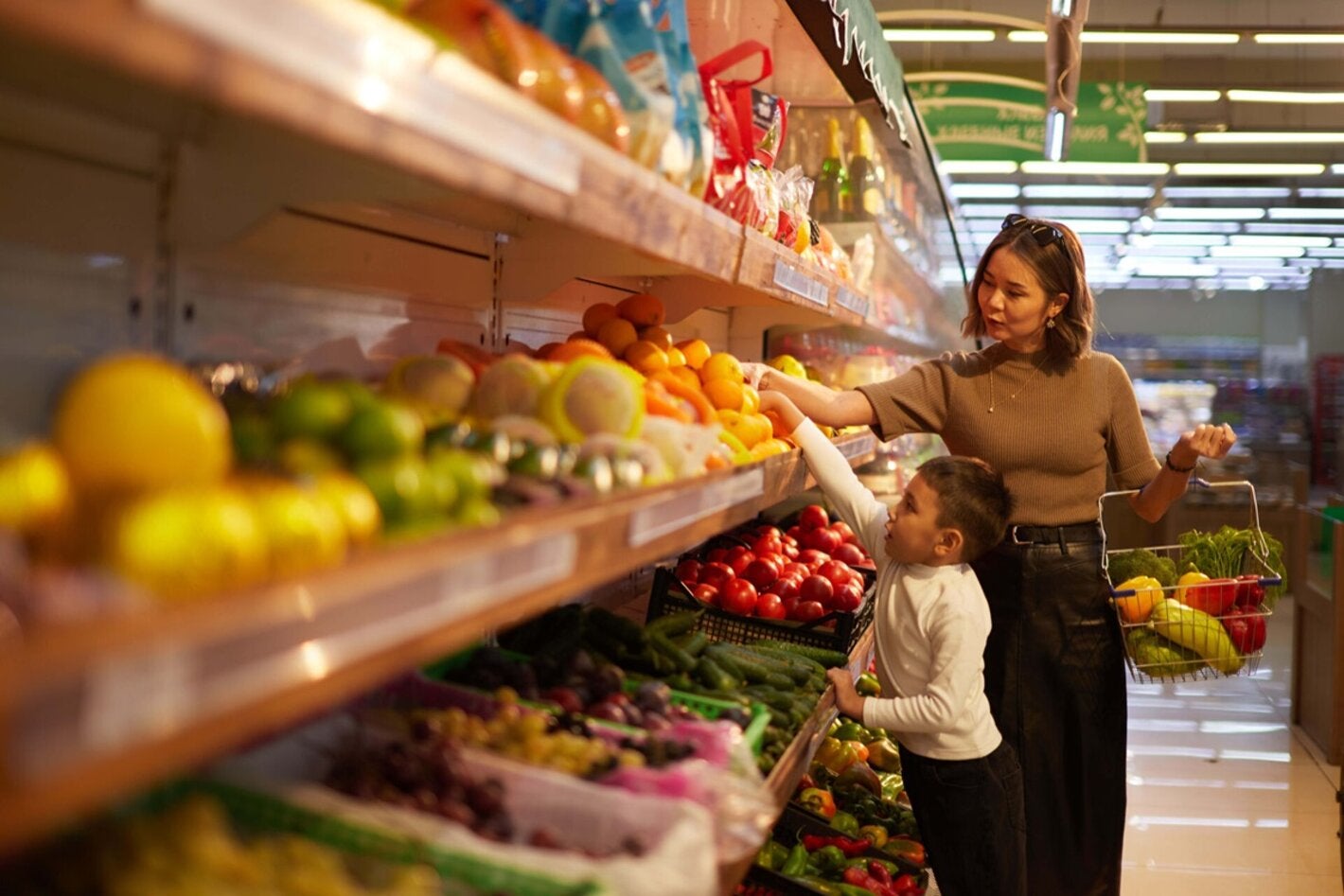 Mother with child shops in a super market