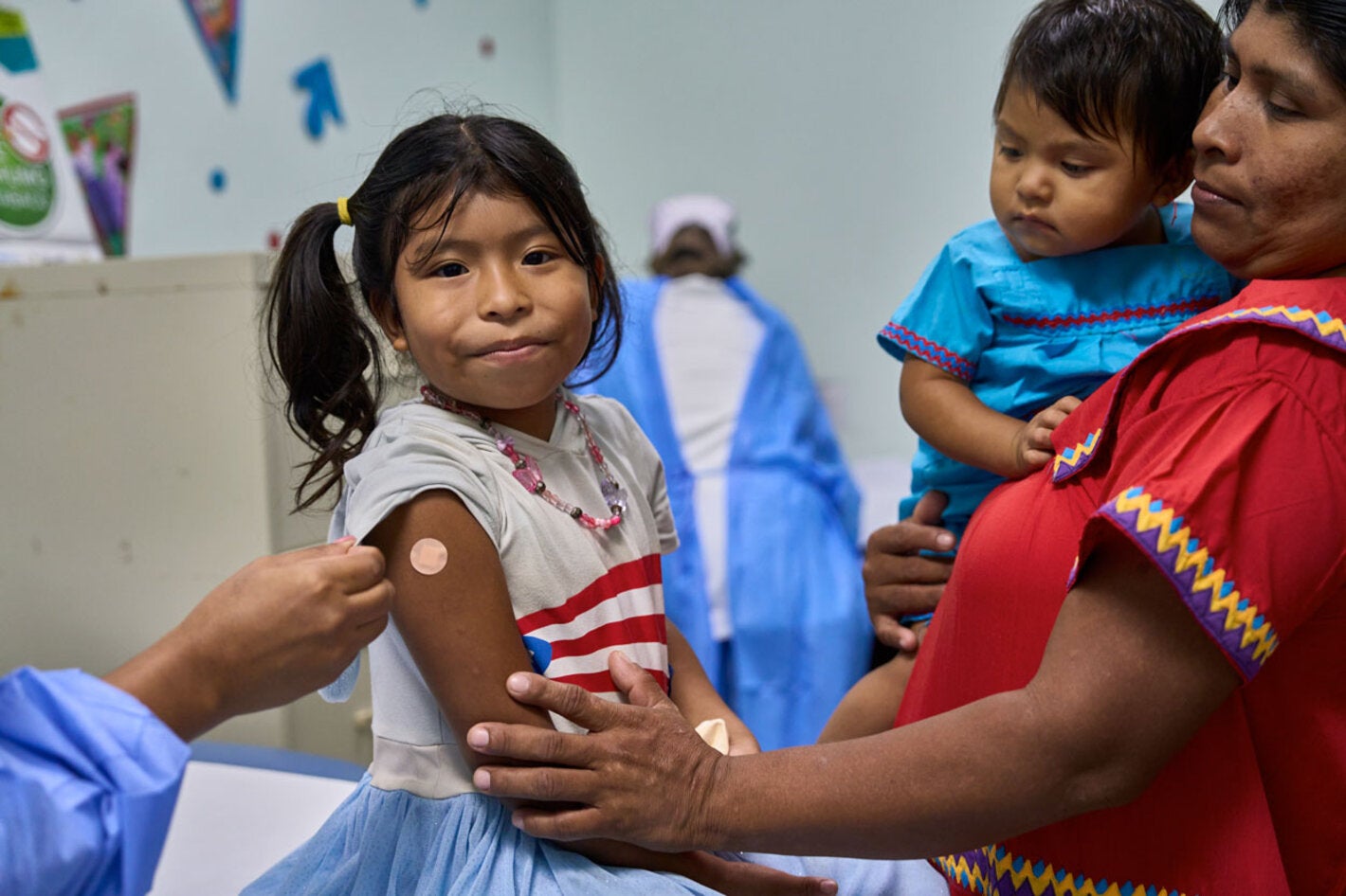 Siblings get vaccinated in las Garzas Health Center in Panama