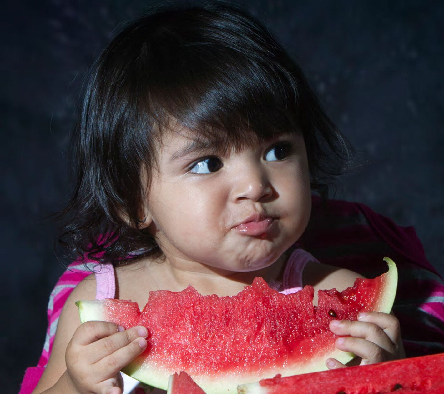 Girl eating fruit