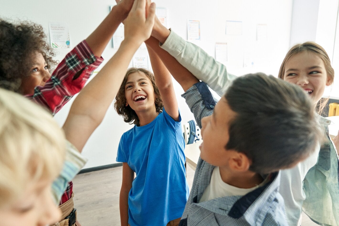 adolescents playing with hands in air