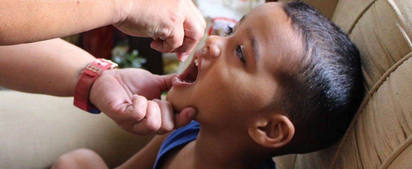 Boy receives polio vaccine