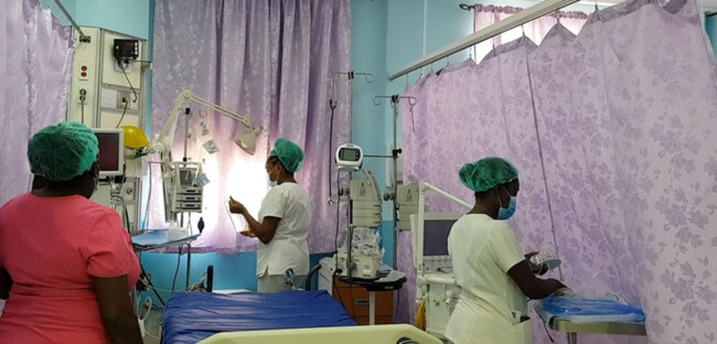 nurses organizing beds in a hospital