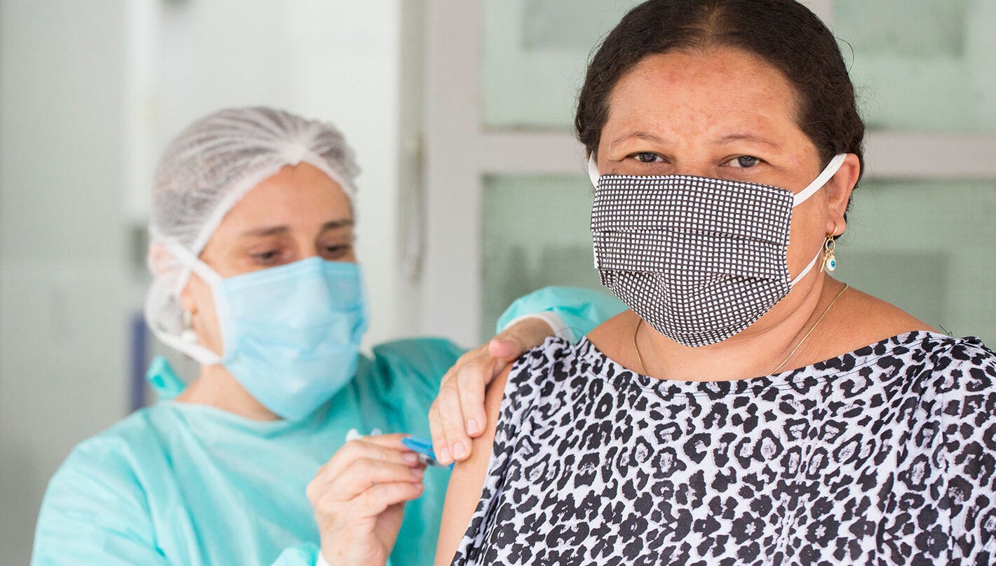 Health care worker administering a vaccine
